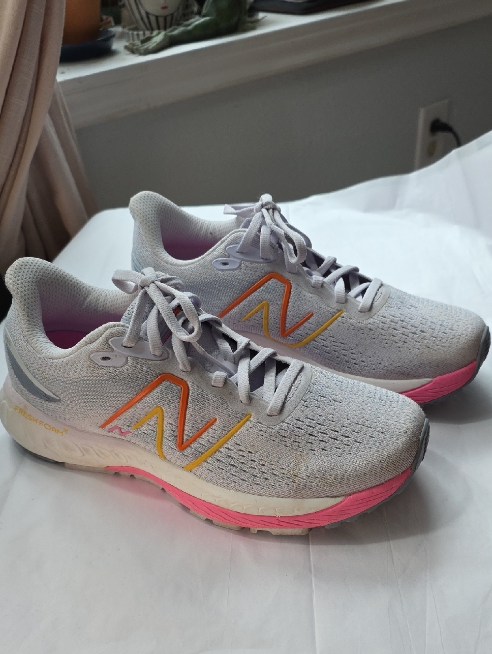 New Balance Women's Light Gray 880 Running Sneakers with Pink and Orange Accents